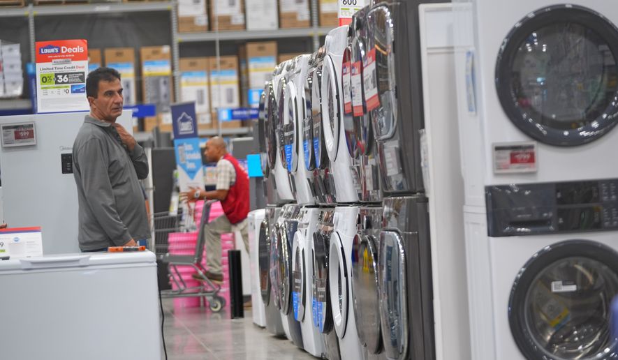 A shopper looks at appliances at a hardware store Tuesday, Oct. 6, 2026, in Dallas. (AP Photo/LM Otero)