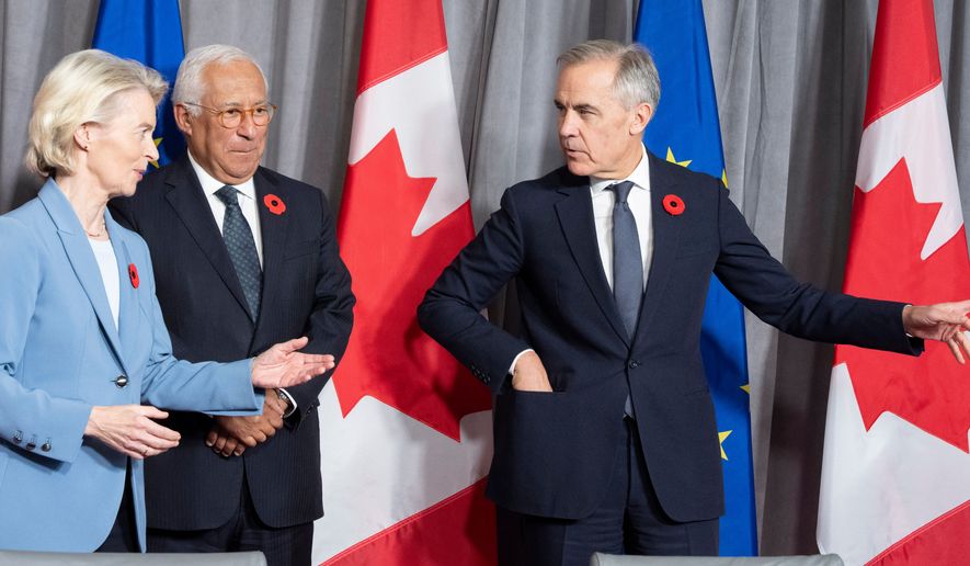 Prime Minister Mark Carney, right, gestures as he arrives with European Commission President Ursula von der Leyen and European Council President Antonio Costa for their closing press conference at the EU-Canada summit in Montreal on Friday, Oct. 30, 2026. (Christinne Muschi /The Canadian Press via AP)