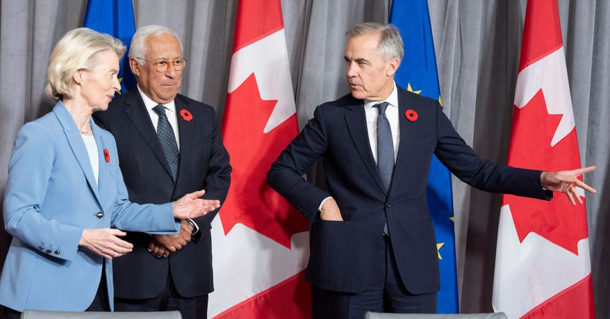 Prime Minister Mark Carney, right, gestures as he arrives with European Commission President Ursula von der Leyen and European Council President Antonio Costa for their closing press conference at the EU-Canada summit in Montreal on Friday, Oct. 30, 2026. (Christinne Muschi /The Canadian Press via AP)