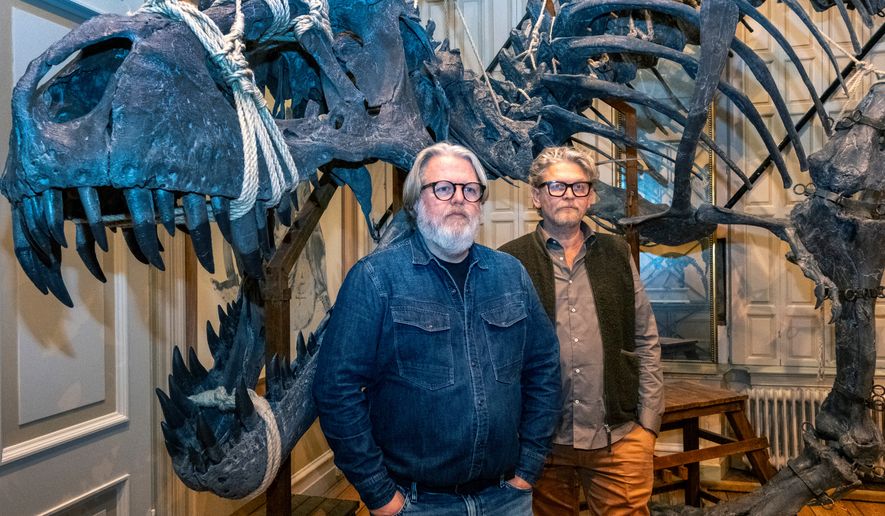 Dutch taxidermists Jaap Sinke, left, and Ferry van Tongeren pose for a photo at the Art Zoo in Amsterdam, Netherlands, on Oct. 27, 2026. (AP Photo/Patrick Post)