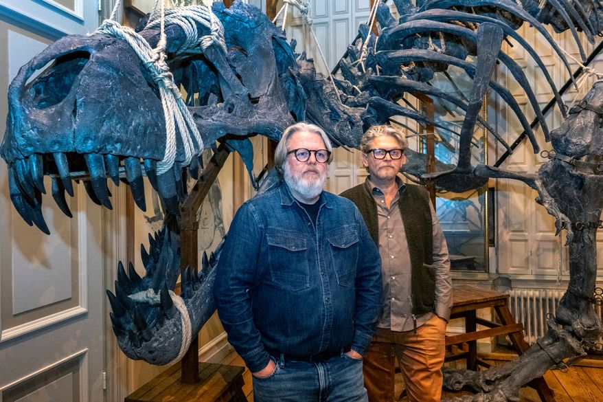 Dutch taxidermists Jaap Sinke, left, and Ferry van Tongeren pose for a photo at the Art Zoo in Amsterdam, Netherlands, on Oct. 27, 2026. (AP Photo/Patrick Post)