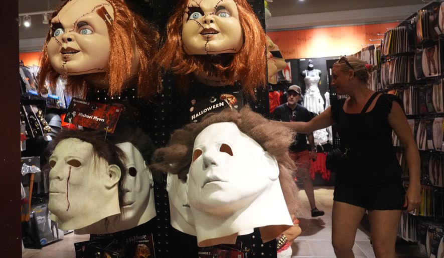 Scary masks are displayed at the Spirit of Halloween store Tuesday, Oct. 13, 2026, in Hallandale Beach, Fla. (AP Photo/Marta Lavandier)