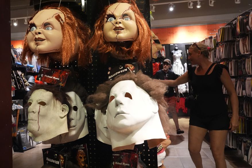 Scary masks are displayed at the Spirit of Halloween store Tuesday, Oct. 13, 2026, in Hallandale Beach, Fla. (AP Photo/Marta Lavandier)