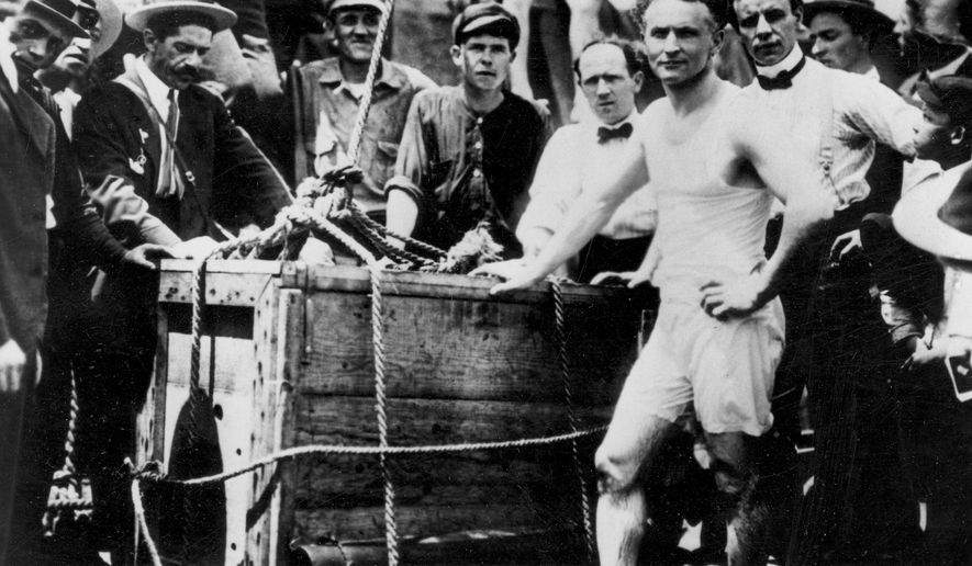 Escape artist Harry Houdini appears before being lowered in a packing crate into the ice-covered Detroit River in 1907. (AP Photo)