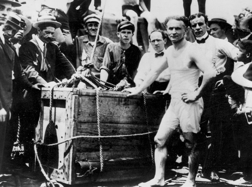 Escape artist Harry Houdini appears before being lowered in a packing crate into the ice-covered Detroit River in 1907. (AP Photo)