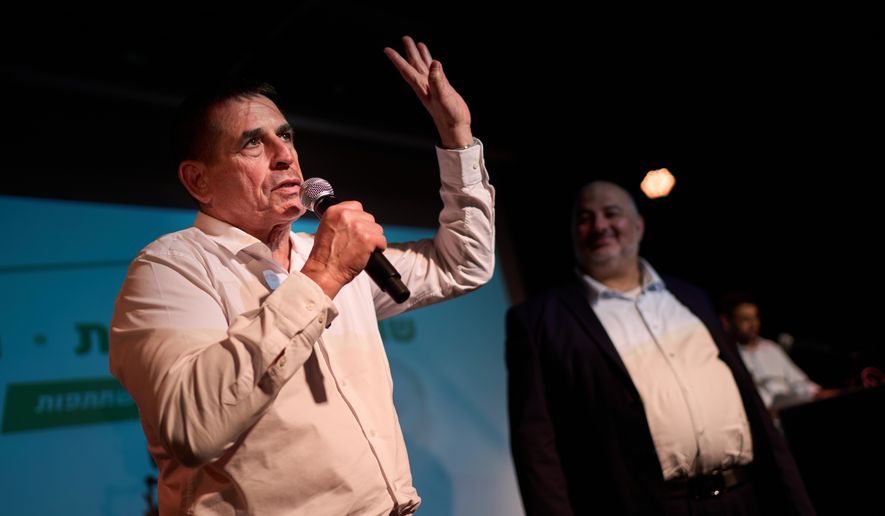 Yoav Segalovitz, a former police investigator running with the Ra'am party, speaks during a campaign event alongside Mansour Abbas, the party's leader, in Tel Aviv, Israel, Friday, Oct. 23, 2026, ahead of the country's general election. (AP Photo/David Goldman)