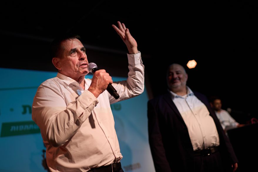 Yoav Segalovitz, a former police investigator running with the Ra'am party, speaks during a campaign event alongside Mansour Abbas, the party's leader, in Tel Aviv, Israel, Friday, Oct. 23, 2026, ahead of the country's general election. (AP Photo/David Goldman)