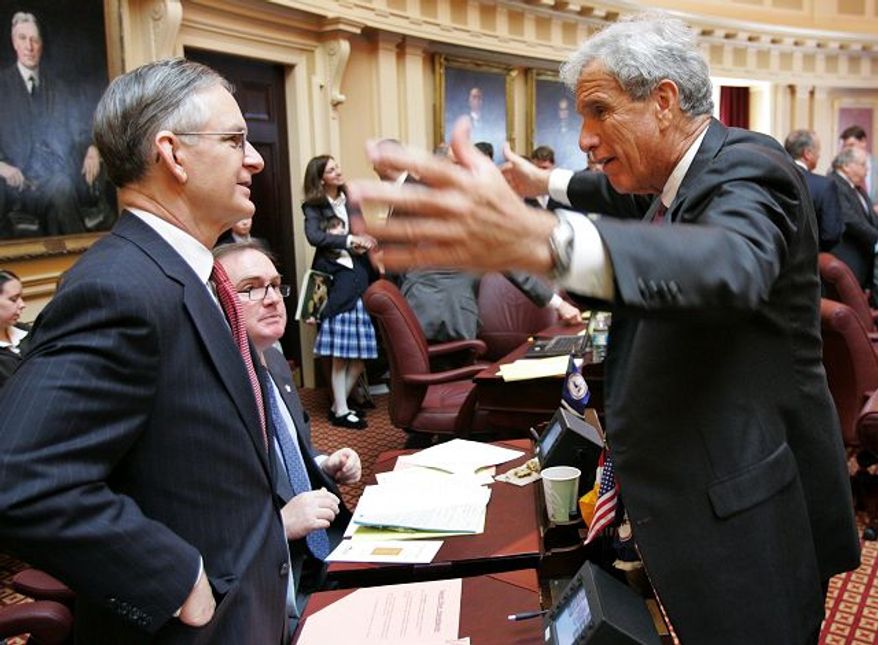 ** FILE PHOTO ** Senate Democratic Leader Richard L. Saslaw (right), Fairfax Democrat, talks with Sen. Thomas K. Norment Jr., James City Republican. (Associated Press)