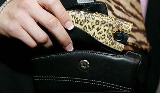 Associated Press
Taser International boasted a leopard-print C2 stun gun available for $379.99, with an optional music-playing holster, at the Consumer Electronics Show, a technology convention held in Las Vegas.