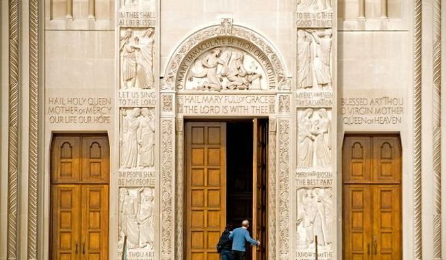 ** FILE ** People enter the Basilica of the National Shrine of the Immaculate Conception on the campus of Catholic University in Washington. (The Washington Times)